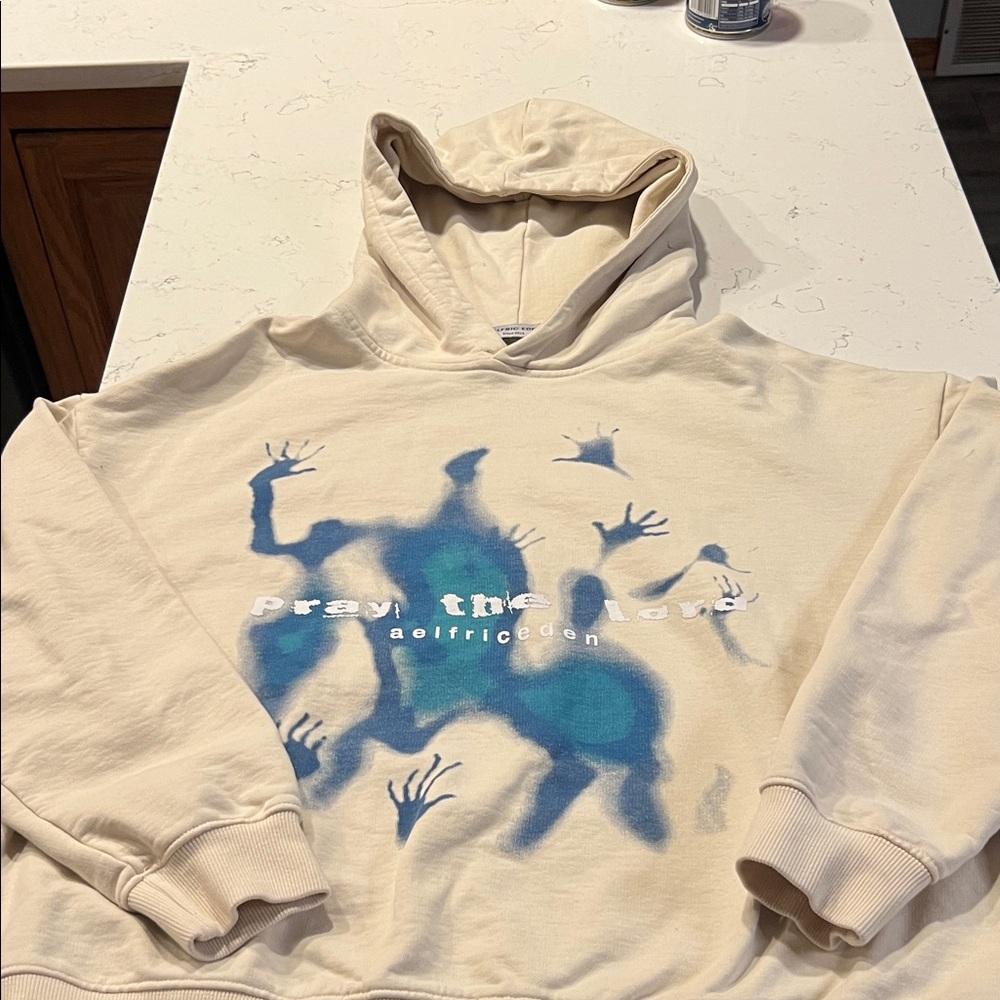 AELFRIC EDEN  Pray The LordCream Hoodie with Blue Graphic